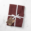 Burgundy Apron Packaged for Gift Giving in Reluctant Trading Printed Cloth Tape