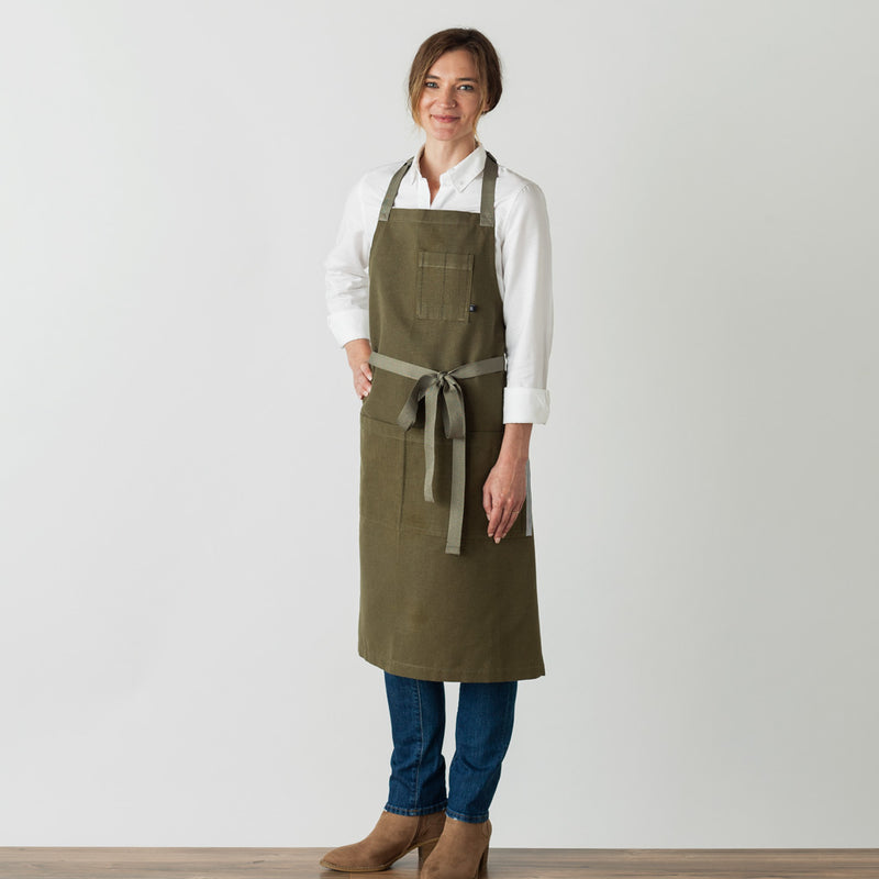 Chef's Apron, Olive Green with Tan Straps, Men or Women, model front view-The Reluctant Trading Experiment