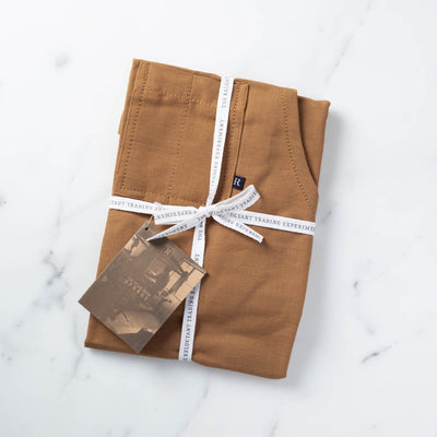 Ochre Apron Packaged for Gift Giving in Reluctant Trading Cloth Tape