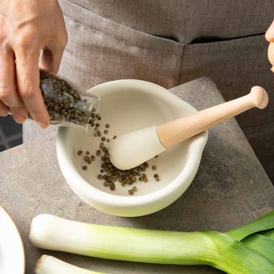 Pouring Green Peppercorns into our Mortar and Pestle