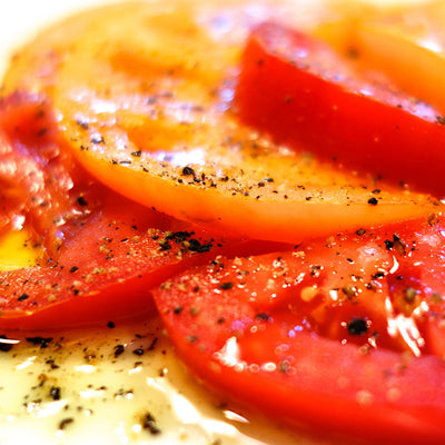 Farmer's market tomatoes with ground Tellicherry Pepper and Icelandic Sea Salt