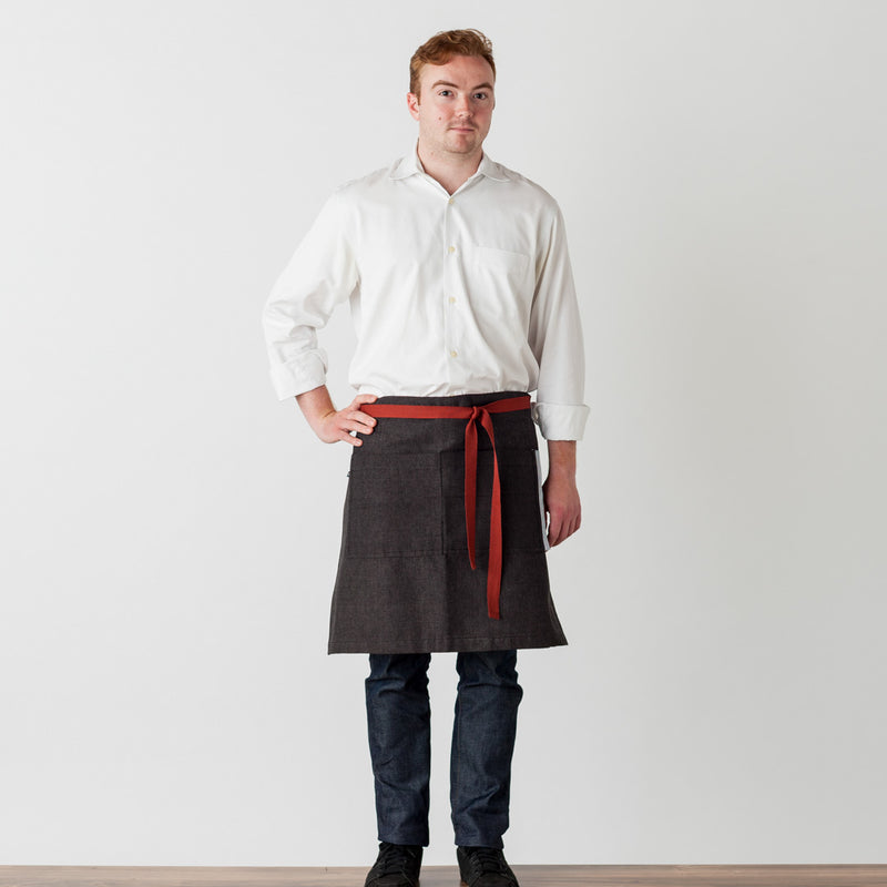 Bistro Apron on Model, Charcoal Black with Tan Straps, Half Apron, Server, Reluctant Trading