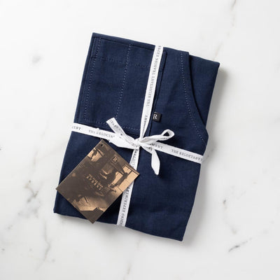 Navy Apron Gift Packaged in Reluctant Trading Fabric Tape