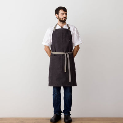 Chef's Apron, Charcoal Black with Tan Straps, Men or Women-Reluctant Trading, model front view