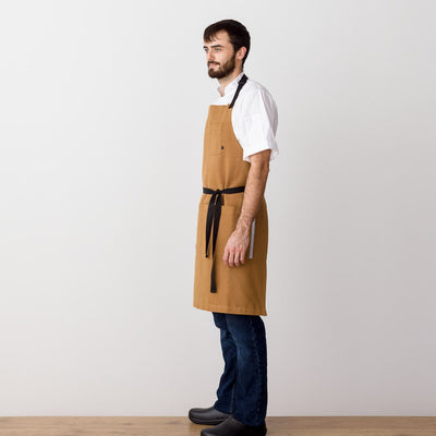 Chef's Apron, Ochre with Black Straps, Carhartt color, Men or Women, model side view-Reluctant Trading