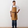 Chef's Apron, Ochre with Black Straps, Carhartt color, Men or Women, model front view-Reluctant Trading