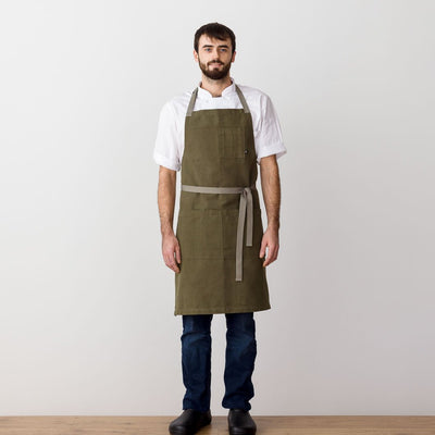 Chef's Apron, Olive Green with Tan Straps, Men or Women, model front view-The Reluctant Trading Experiment