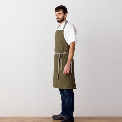 Chef's Apron, Olive Green with Tan Straps, Men or Women, model side view-The Reluctant Trading Experiment